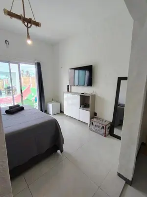 Uma televisão e/ou sistema de entretenimento em KaBeat House Icaraizinho
