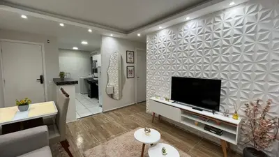 Uma televisão e/ou sistema de entretenimento em Apartamento Completo - Ótima localização