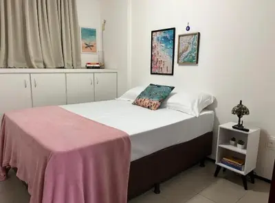 Uma cama ou camas num quarto em Aconchego a 250m da Praia do Náutico