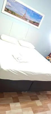 Uma cama ou camas num quarto em Hotel Tabajara Apto 406