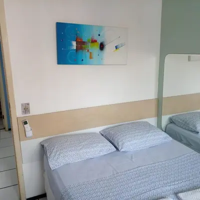 Uma cama ou camas num quarto em Iracema Apartament