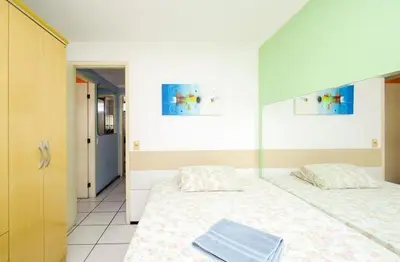 Uma cama ou camas num quarto em Iracema Apartament