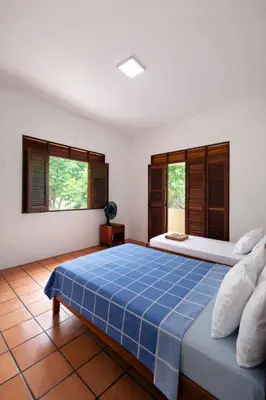 Uma cama ou camas num quarto em Maison Tropical