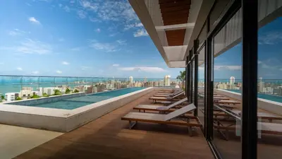 Uma varanda ou terraço em Studio Pérola com Rooftop Vista para o Mar