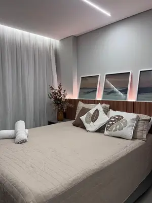 Uma cama ou camas num quarto em Studio Pérola com Rooftop Vista para o Mar