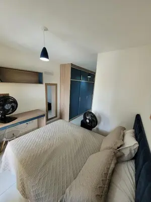 Uma cama ou camas num quarto em Casa duplex em Maracanaú com ar-condicionado