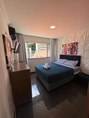 Uma cama ou camas num quarto em Flat com vista mar na orla