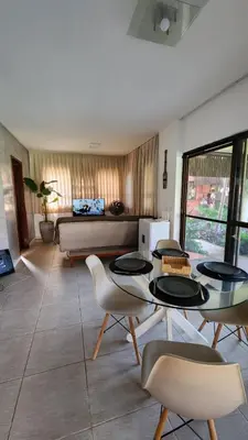 Uma área de estar em Paraíso à Beira Mar - 601H Village