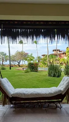 Um jardim no exterior de Paraíso à Beira Mar - 601H Village