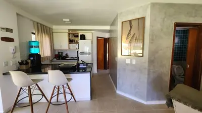 Uma área de estar em Paraíso à Beira Mar - 601H Village