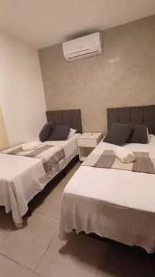 Uma cama ou camas num quarto em Paraíso à Beira Mar - 601H Village