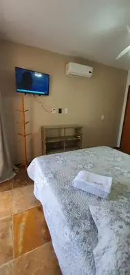 Uma cama ou camas num quarto em Brisa Cumbuco - Apê na Praia
