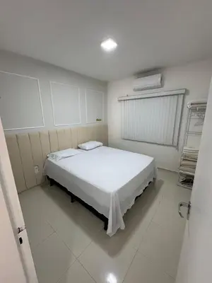 Uma cama ou camas num quarto em Apartamento novo 01