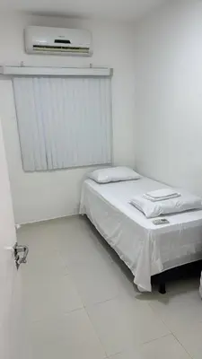 Uma cama ou camas num quarto em Apartamento novo 01