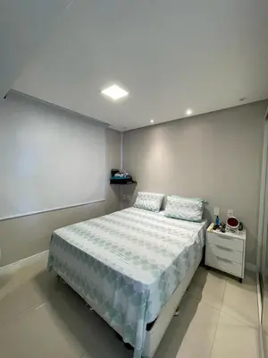 Uma cama ou camas num quarto em Apartamento com vista para o mar - Caravelli