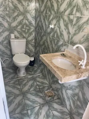 Uma casa de banho em Coqueiros Lounge