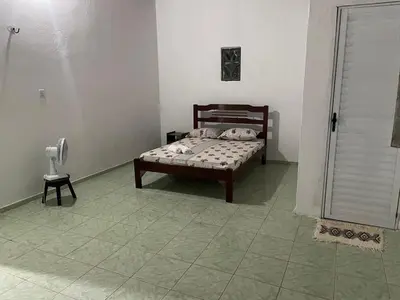 Uma cama ou camas num quarto em Coqueiros Lounge