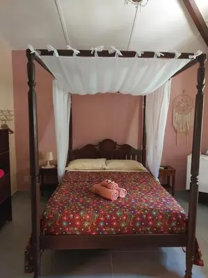 Uma cama ou camas num quarto em Manga Rosa Hospedagem