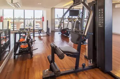 O centro de fitness e/ou as comodidades de fitness de JSmart #1106 - Apê confortável por Carpediem