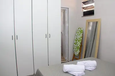 Uma cama ou camas num quarto em casa em fortaleza bairro parquelândia