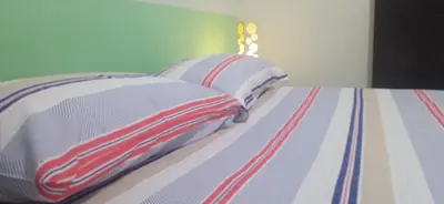 Uma cama ou camas num quarto em casa em fortaleza bairro parquelândia