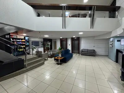 Uma área de estar em Praia Mansa Suite Hotel Flat