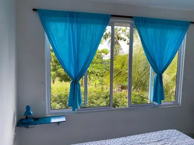 Uma cama ou camas num quarto em casa da Anastacia