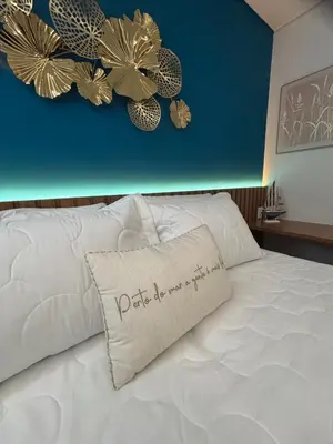 Uma cama ou camas num quarto em Beach Class Meireles