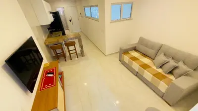 Uma televisão e/ou sistema de entretenimento em Apartamento Praia de Iracema 1