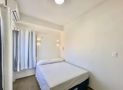 Uma cama ou camas num quarto em Flats Tabajara Residence