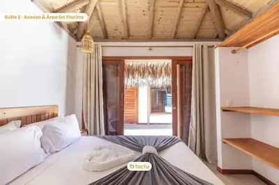 Uma cama ou camas num quarto em Vila Carnaúba no condomínio Praia Canoé Fortim