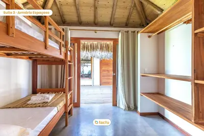 Uma cama ou camas num quarto em Vila Carnaúba no condomínio Praia Canoé Fortim