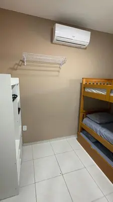 Uma cama ou camas num quarto em Residencial Portela 08B