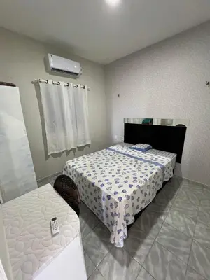 Uma cama ou camas num quarto em Apartamento em Fortaleza