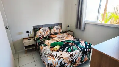 Uma cama ou camas num quarto em Casa Mimouna, Jardim do Éden próximo às praias