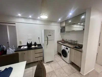 A cozinha ou kitchenette de Flat Acolhedor e Familiar