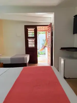 Uma cama ou camas num quarto em Pousada Calamarina