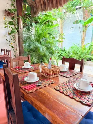 Um restaurante ou outro lugar para comer em Pousada Calamarina