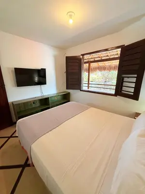Uma cama ou camas num quarto em Pousada Calamarina