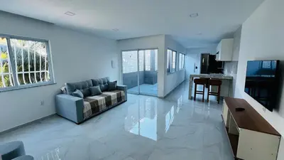 Uma televisão e/ou sistema de entretenimento em Apartamento praia de Iracema