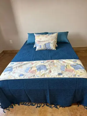Uma cama ou camas num quarto em SWEET HOME Águas Belas