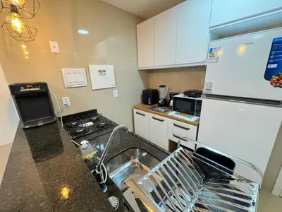 A cozinha ou kitchenette de Ap próx ao Shopping com garagem, piscina e ar