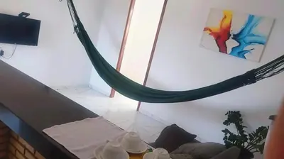 Uma televisão e/ou sistema de entretenimento em Pousada Residencial Manzuá