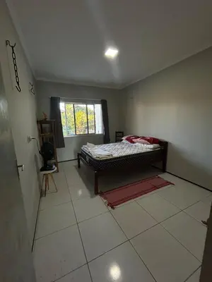 Uma cama ou camas num quarto em Casa vista mar, perfeita para família e amigos