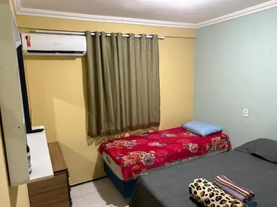 Uma cama ou camas num quarto em No melhor local da praia do futuro em fortaleza