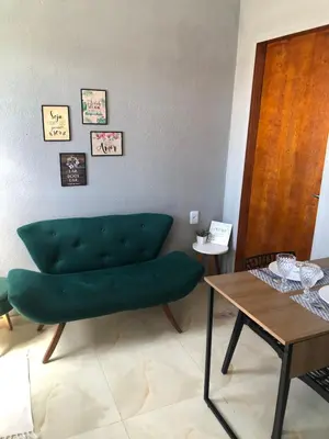 Uma área de estar em Chalé Vista ao Mar gray