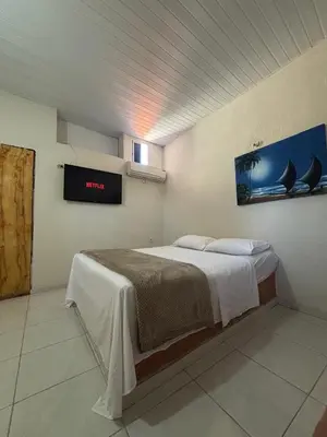 Uma cama ou camas num quarto em Pousada Casa Marelle