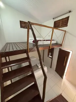 Uma ou mais camas em beliche num quarto em Pousada Casa Marelle