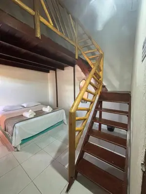 Uma cama ou camas num quarto em Pousada Casa Marelle