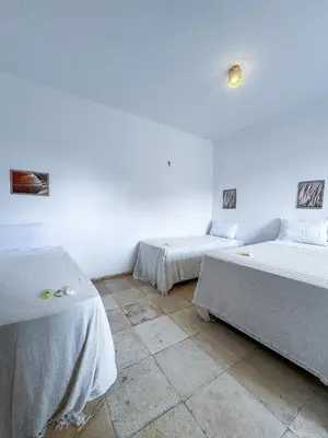 Uma cama ou camas num quarto em Pousada Mahalo Preá Beach